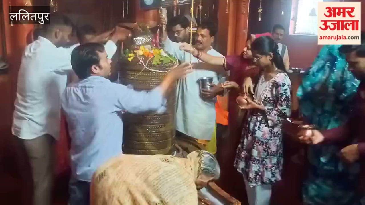 Devotees performed *Jalabhishek* amidst a light drizzle on the second Monday of the month of Sawan.