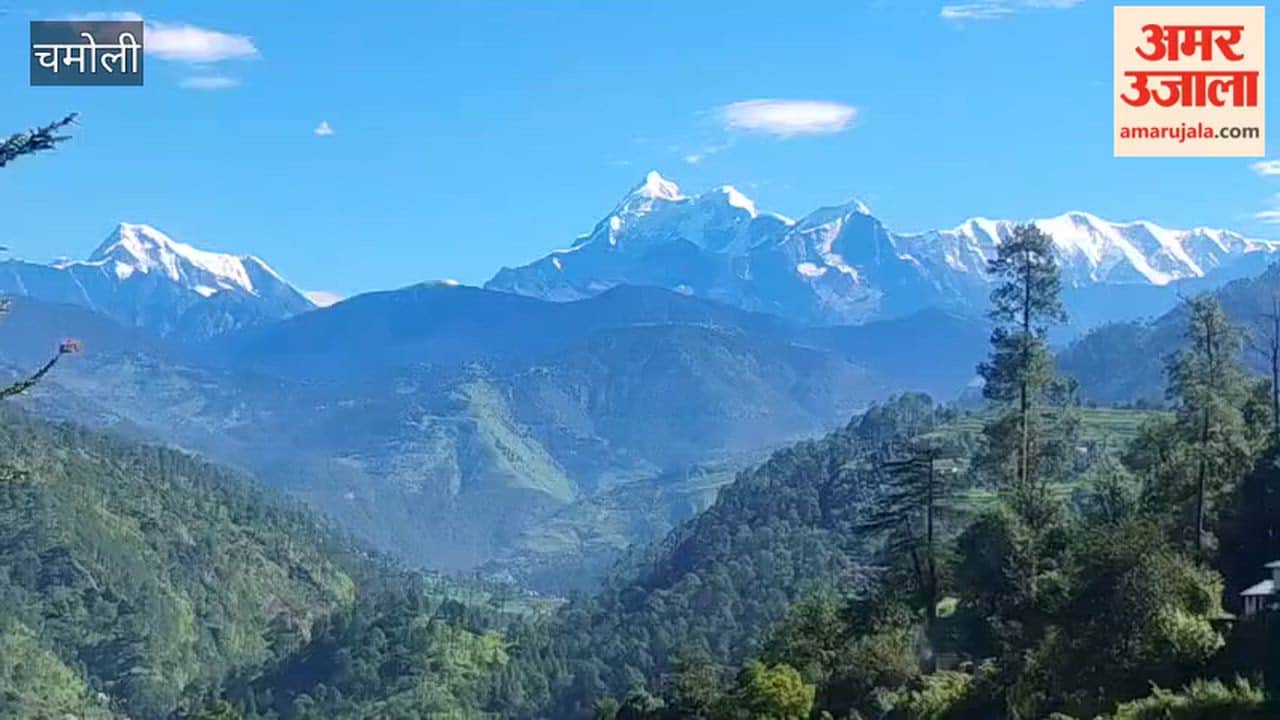 Weather clears up in Tharali after rain; peaks of Nanda Ghunghuti and Trishul become visible.