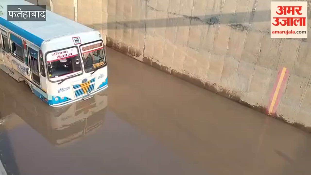 Panic ensued after a Roadways bus got stranded in water; villagers rescued 50 passengers safely with the help of a tractor.
