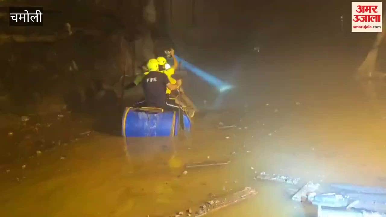Chamoli tunnel incident; personnel are carrying out rescue operations using drums in a tunnel filled with debris and water