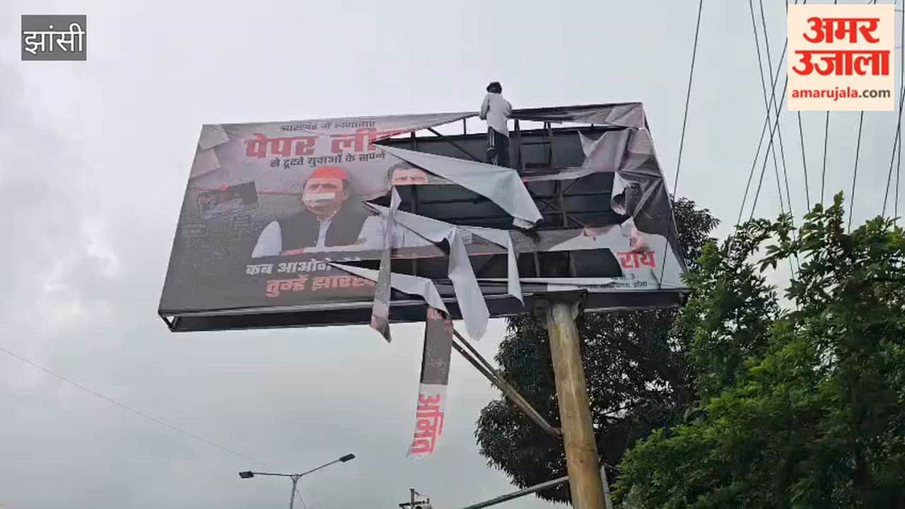 Councilor's hoarding targets SP-Congress; sparks political uproar.