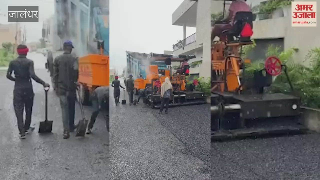 Contractor laying road in Jalandhar's Gulmohar City amidst rain; BJP District President raises questions.