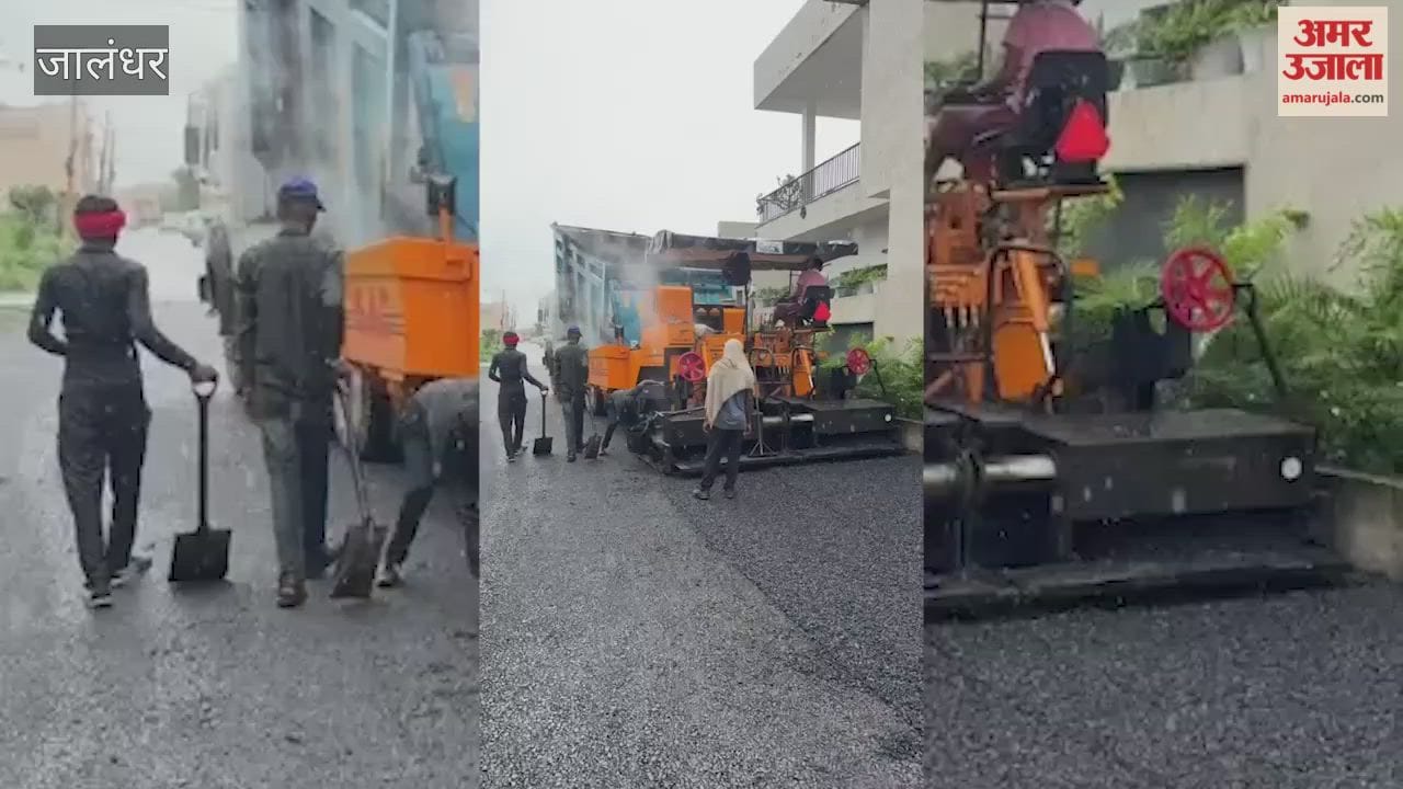 Contractor laying road in Jalandhar's Gulmohar City amidst rain; BJP District President raises questions.