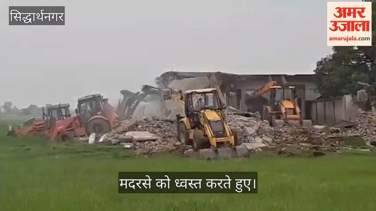 Madrasa built on government land demolished by bulldozer.