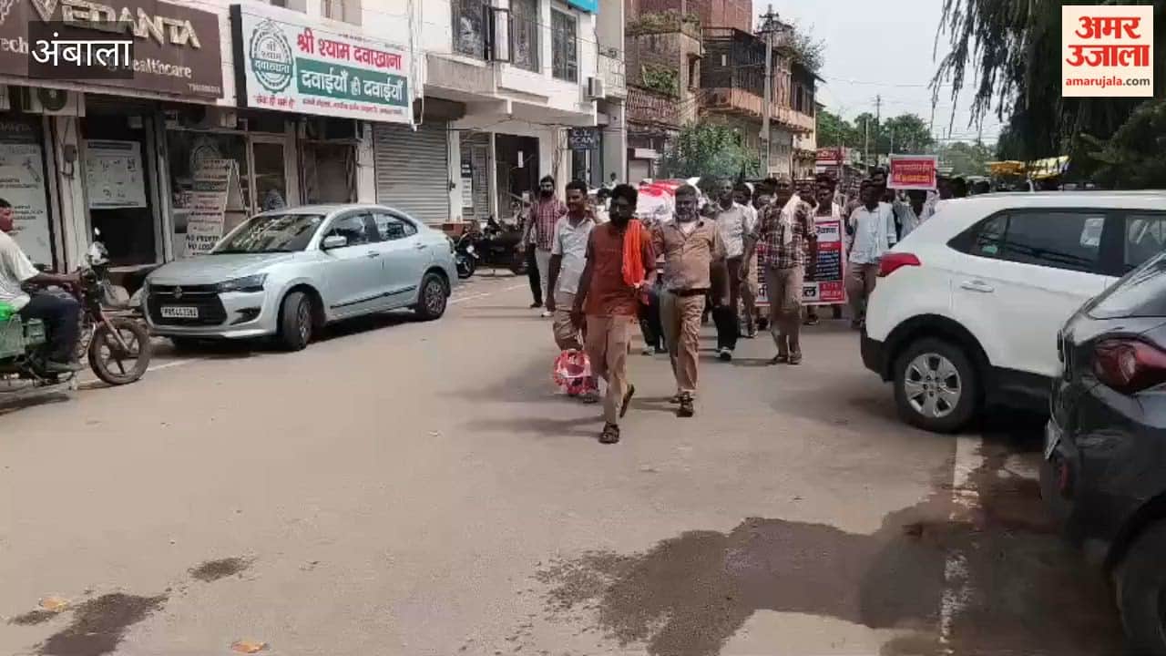 Ambala municipal employees stage protest; union president narrowly escapes during effigy burning.