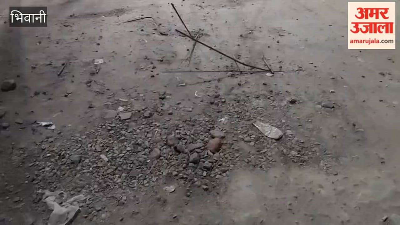 Exposed iron rods from the drain at Bhiwani's Valmiki Chowk pose an accident risk.