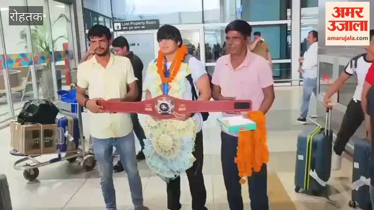 Team returning to Delhi Airport after winning 5 medals at the World Wrestling Championship in Rohtak receives a welcome; villagers from Morkheri felicitate Coach Pradeep