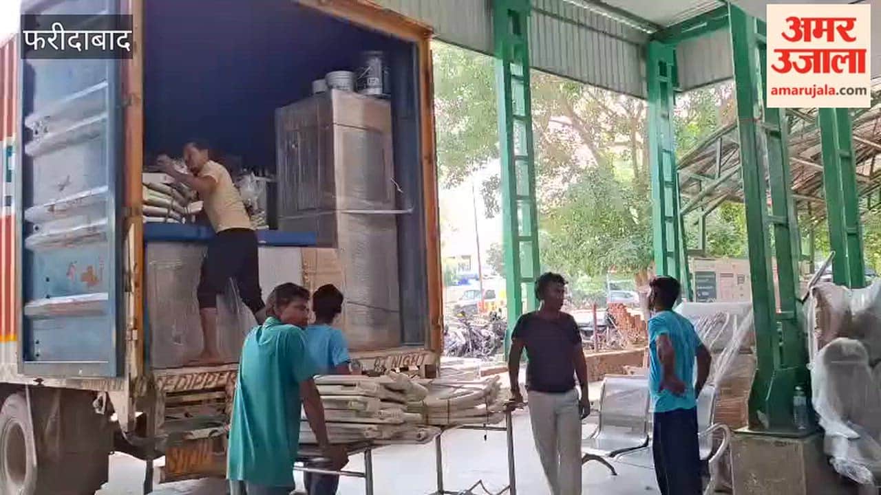 Equipment from the Faridabad Heart Center is being unloaded from the truck and moved back into the Heart Center