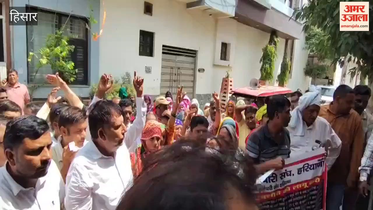 Sanitation and fire department workers gheraoed the MLA's residence in Hansi.