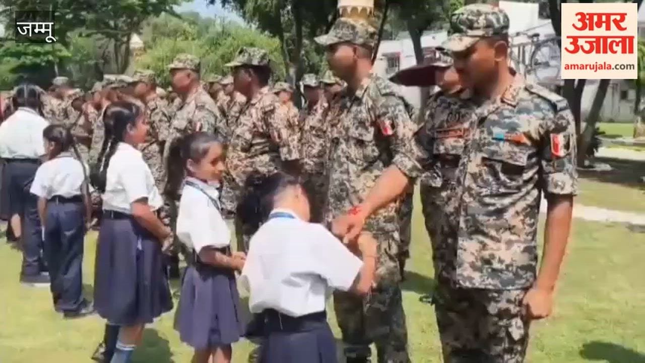 school children and locals tie Rakhis to soldiers.