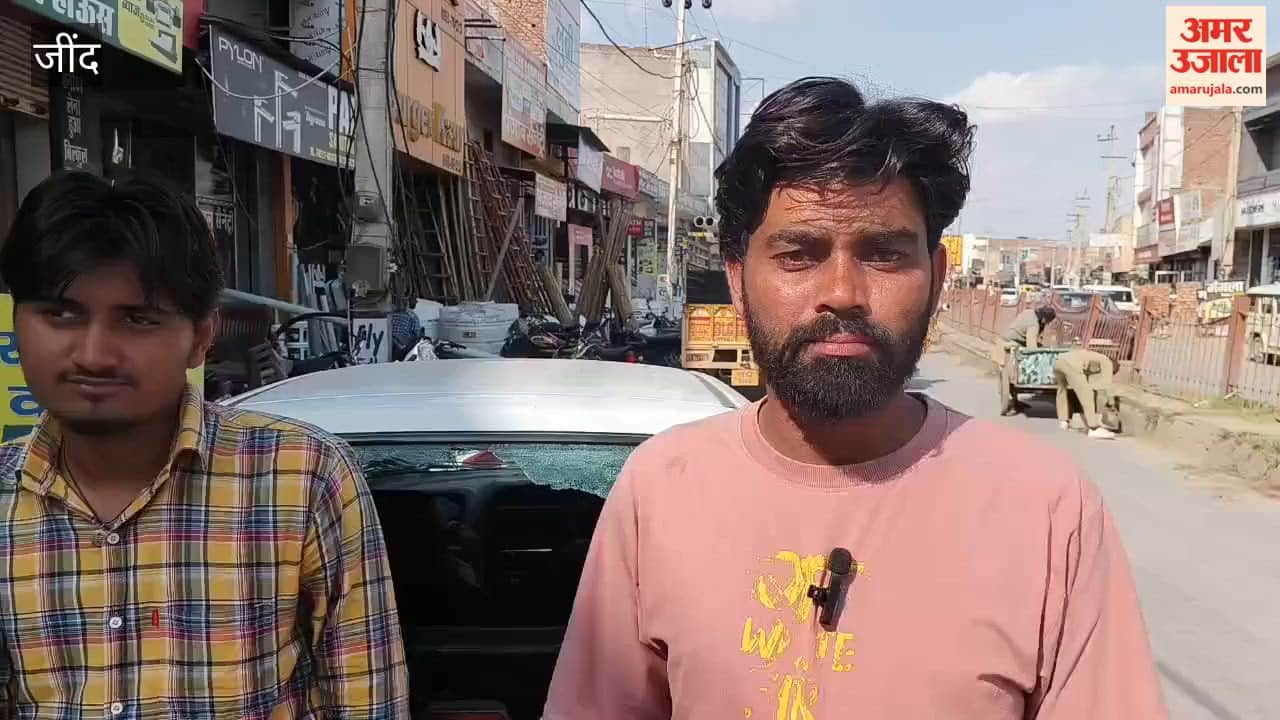 Two youths riding a scooter broke the glass of a car.