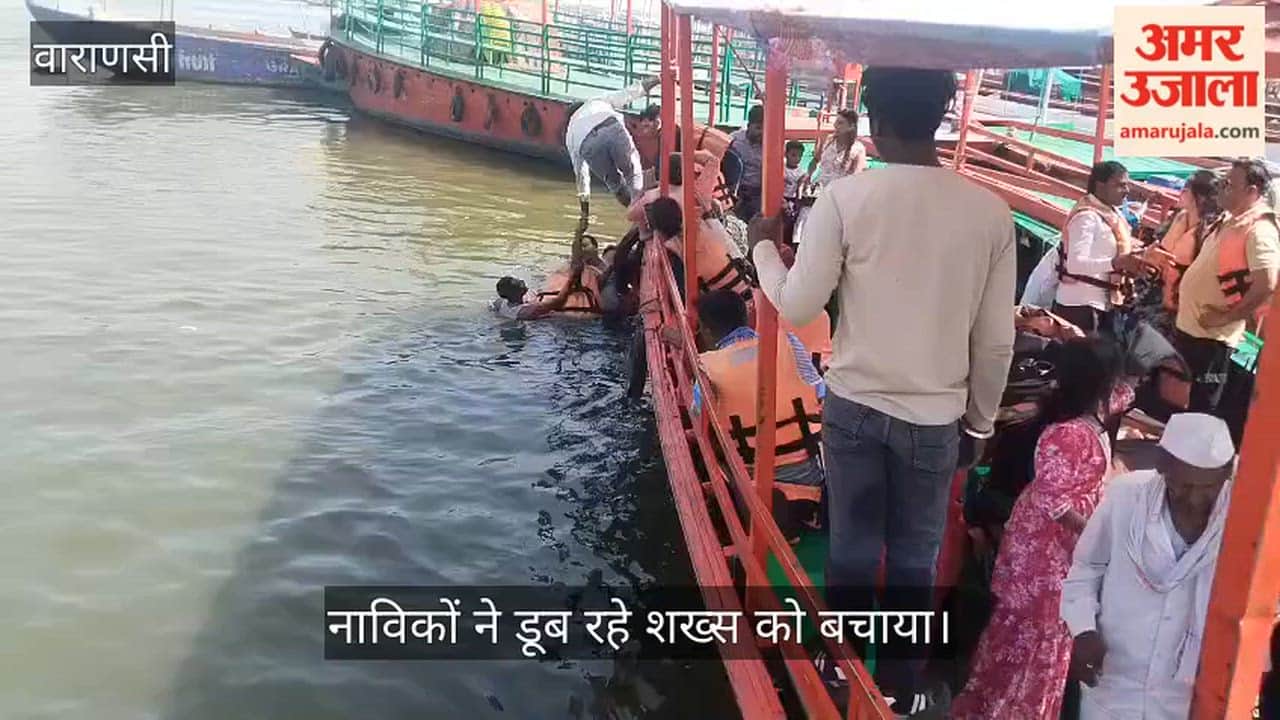 Boatmen rescued a man drowning in the Ganges.