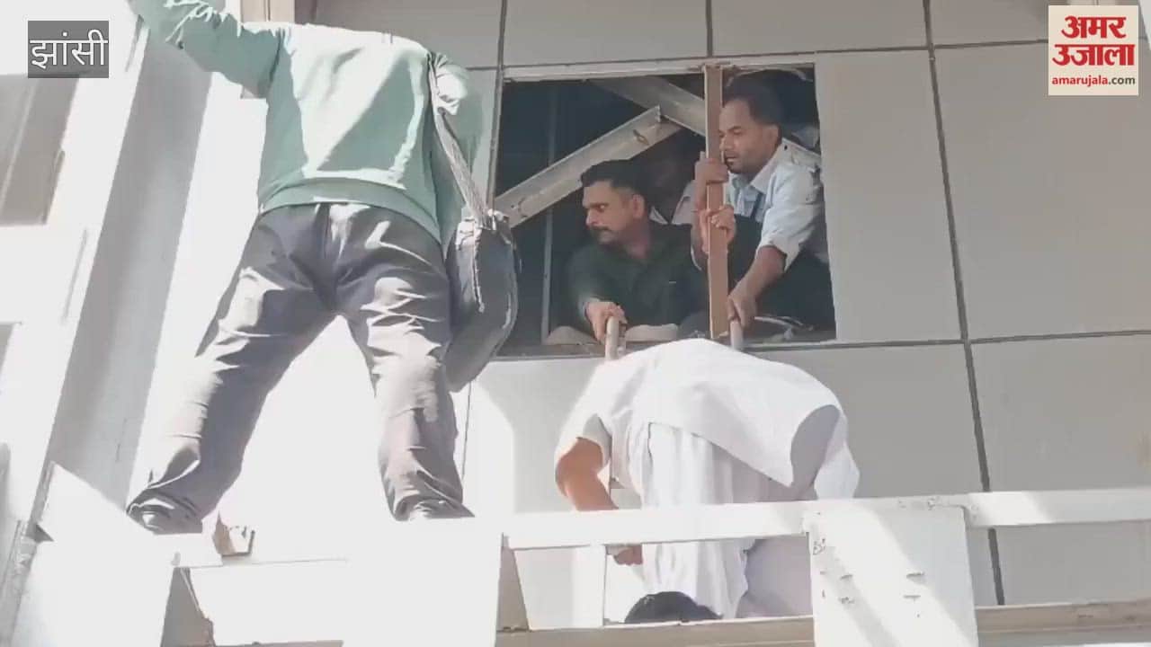 Seven people, including railway employees and children, were trapped in a lift at Jhansi station for an hour and were rescued.