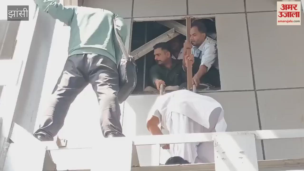 Seven people, including railway employees and children, were trapped in a lift at Jhansi station for an hour and were rescued.