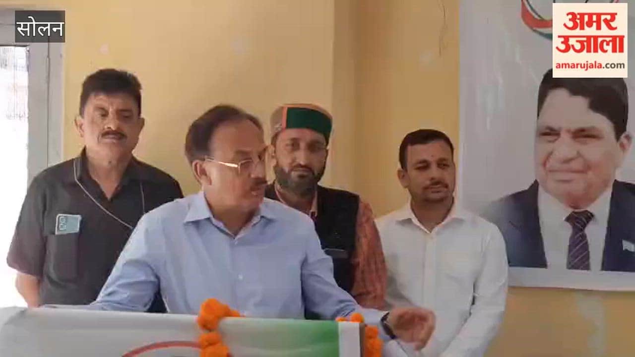 Solan Industries Minister Harshwardhan Chauhan who arrived to receive applications from Congress candidates, was welcomed with floral garlands