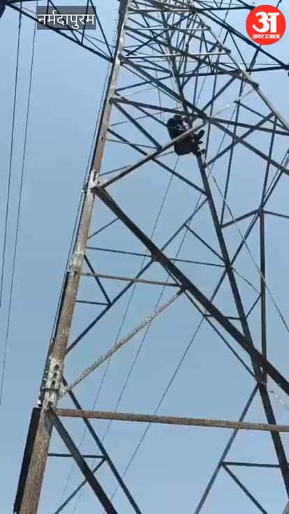 A young man climbed a 120-foot-high high-tension tower in Jamun Dhol village over a love affair