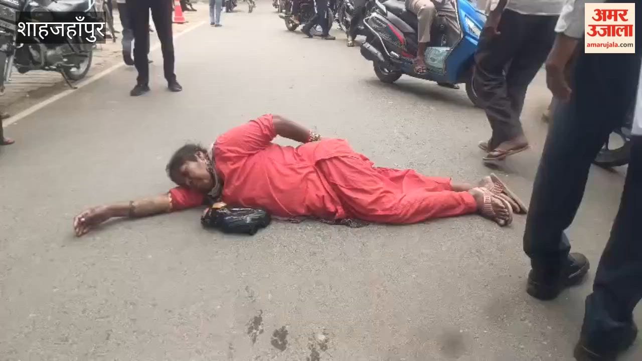 Woman Lies on Road Outside Collectorate Gate in Shahjahanpur