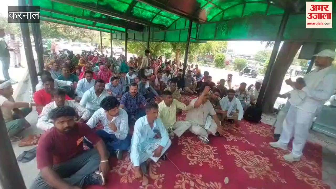 Sanitation workers staging a sit-in protest outside the Karnal Municipal Corporation.