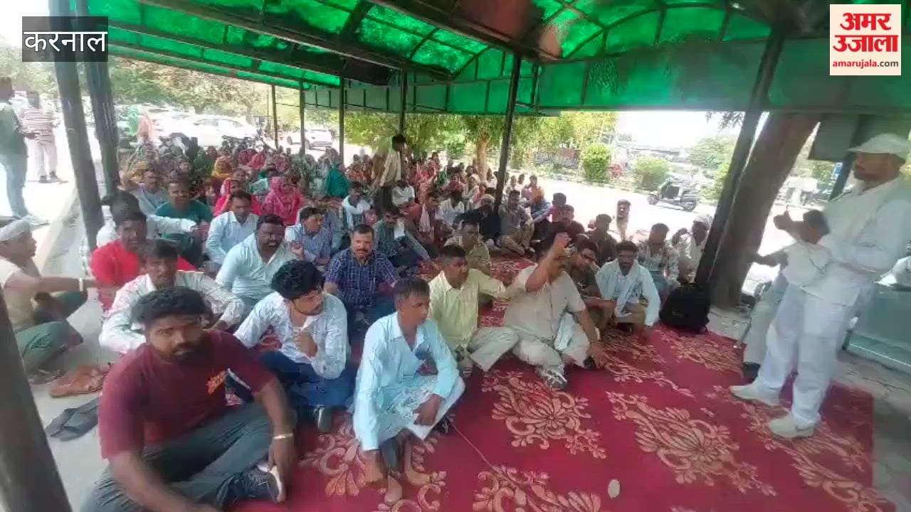 Sanitation workers staging a sit-in protest outside the Karnal Municipal Corporation.