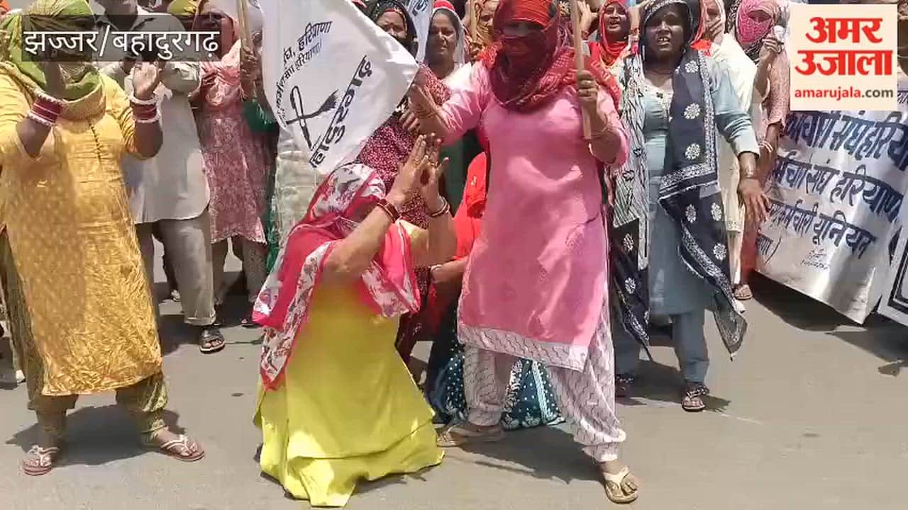 On the 12th day of the strike in Bahadurgarh, sanitation workers staged a protest using inverted brooms and plates with spoons.