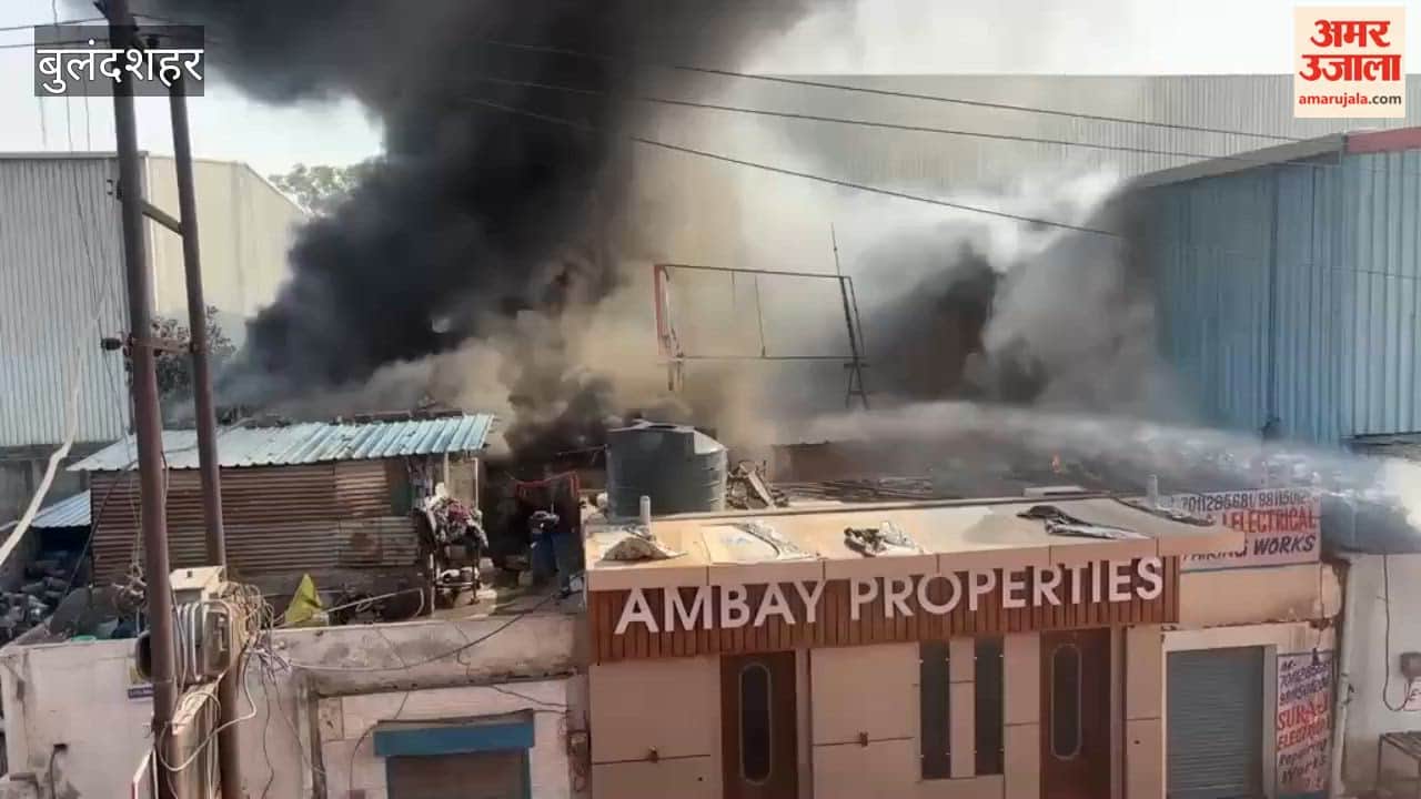Fire at a factory in industrial zone black smoke visible from distance