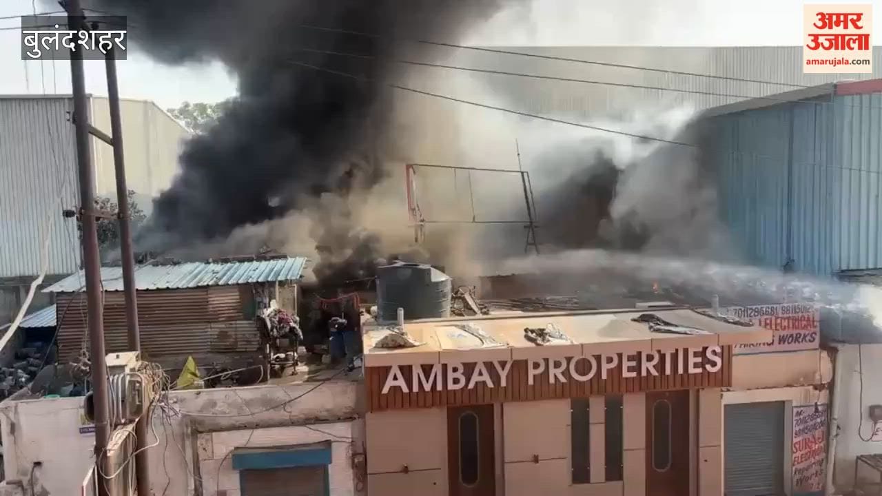 Fire at a factory in industrial zone black smoke visible from distance