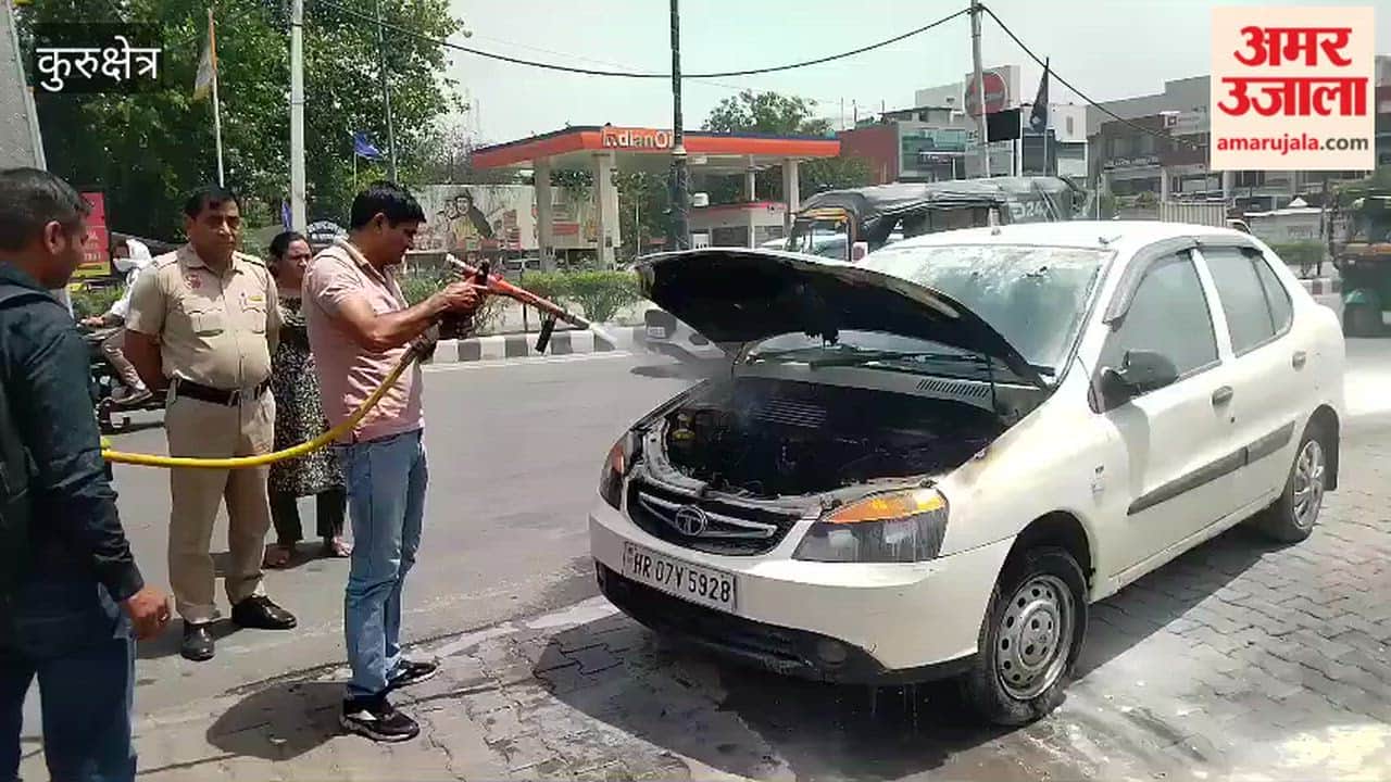 A moving car caught fire in front of a petrol pump