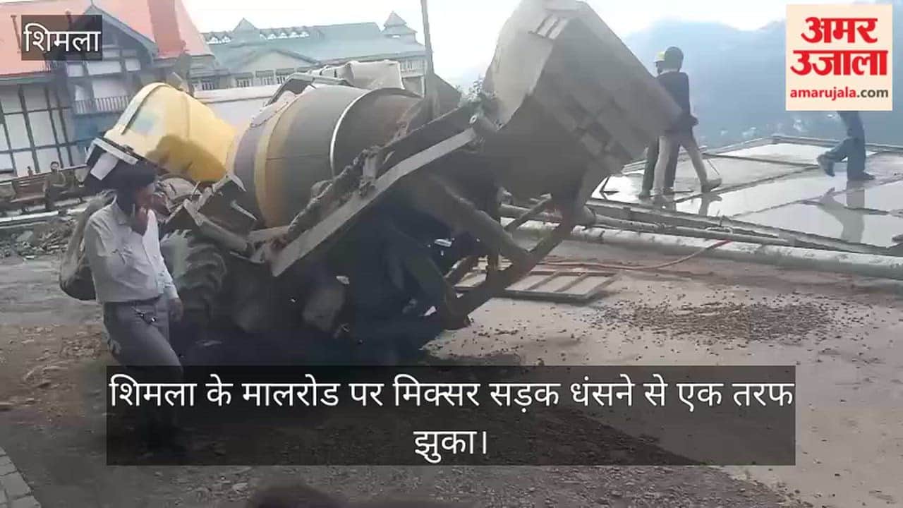 mixer on Shimla's Mall Road tilted to one side after the road caved in.