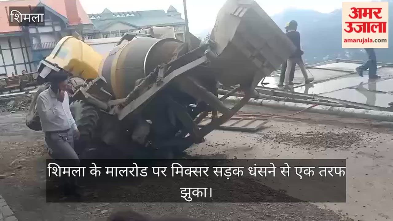 mixer on Shimla's Mall Road tilted to one side after the road caved in.