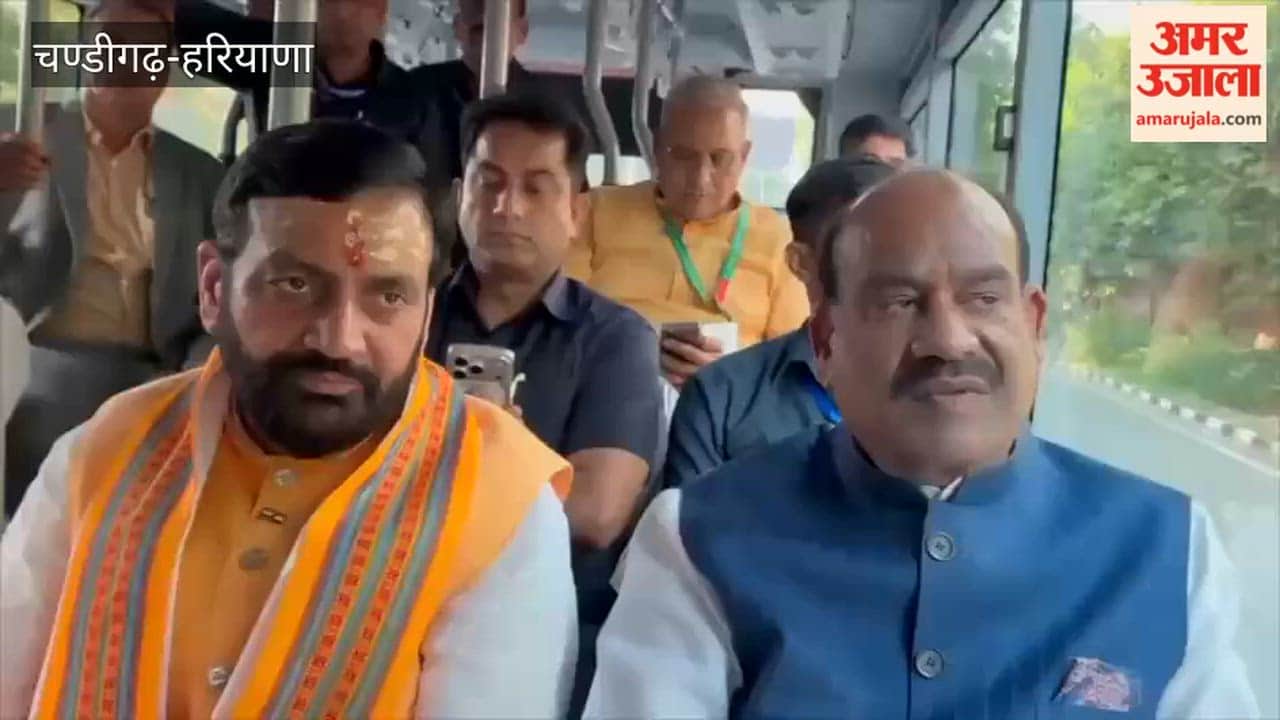 CM Nayab Saini seated in an e-bus with the Lok Sabha Speaker.