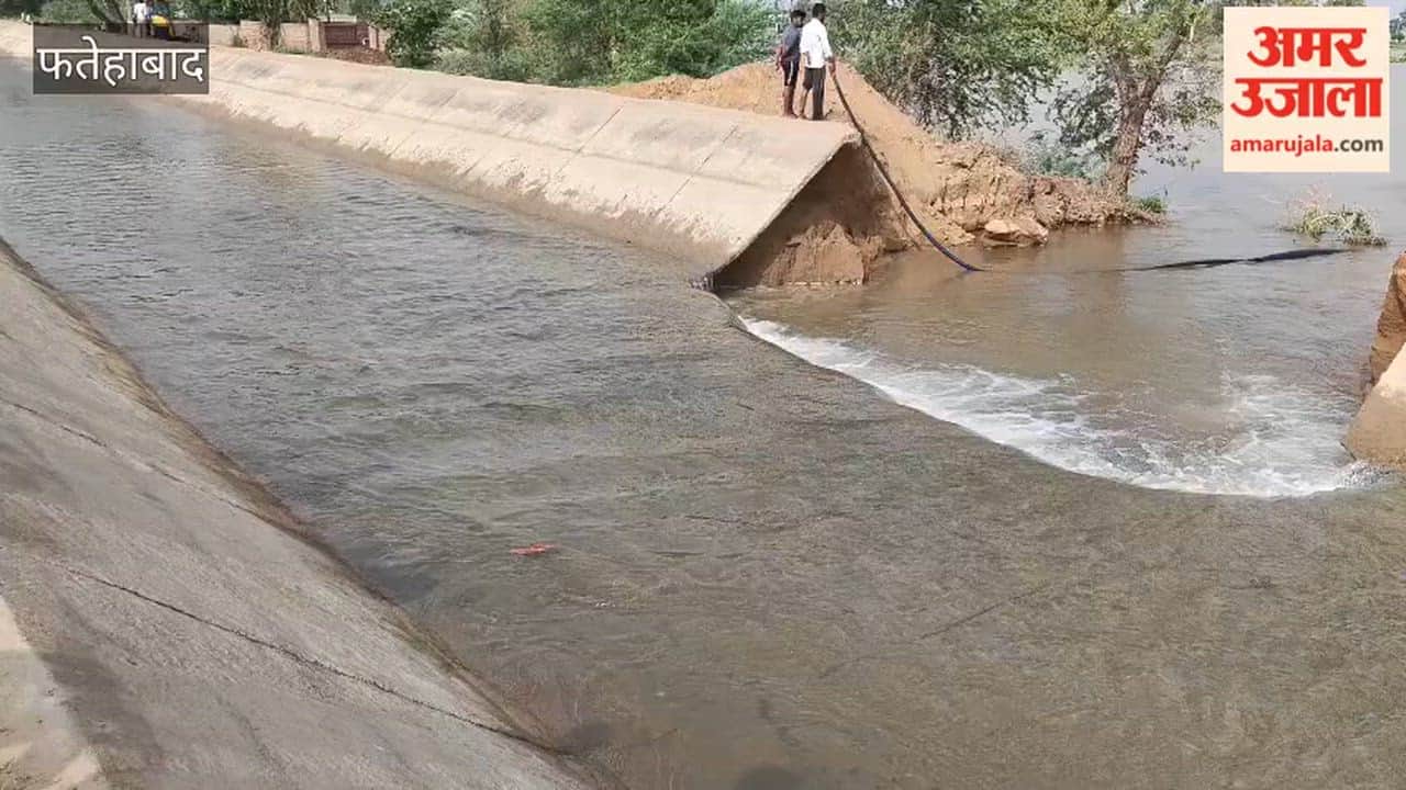 Sirsa Branch canal breaches at Bhodiakhera in Fatehabad; water floods several acres due to Irrigation Department's negligence.