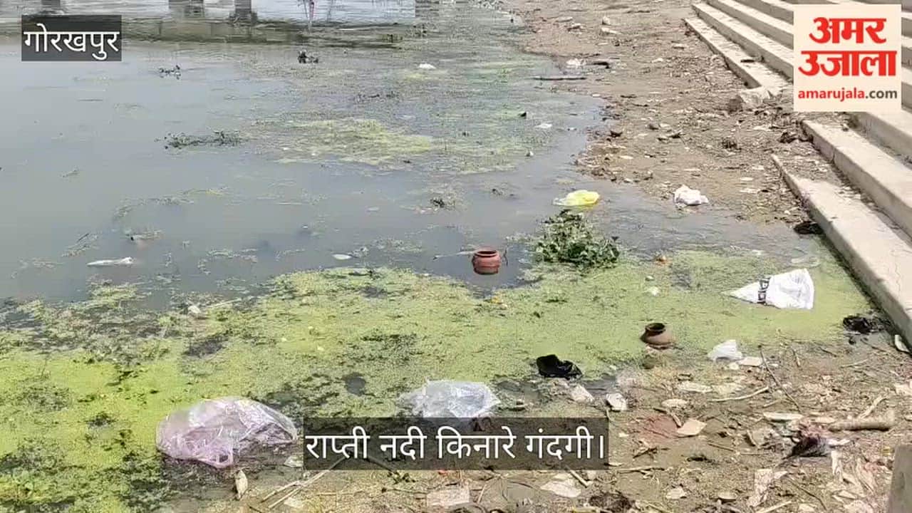 Heaps of filth and accumulated household waste along the banks of the Rapti River at Rajghat.