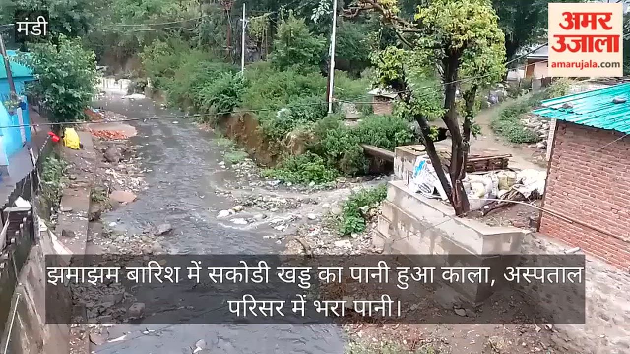 Water in Sakodi Khad turns black amidst heavy rain; hospital premises flooded.