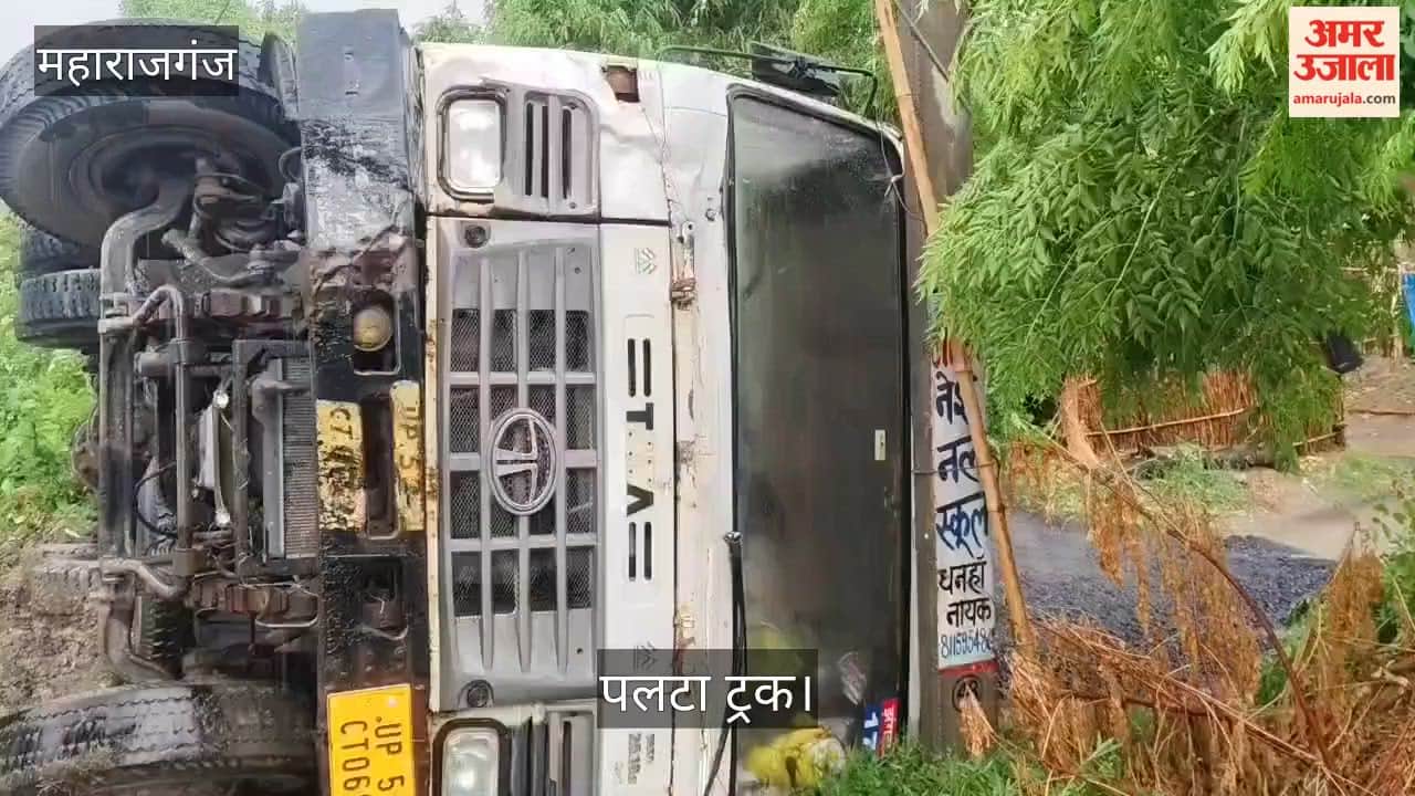 Trailer overturns amidst rain; major accident averted.
