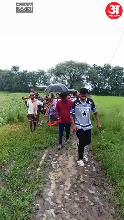Poor Road Forces Villagers to Carry Elderly Woman on Cot to Hospital