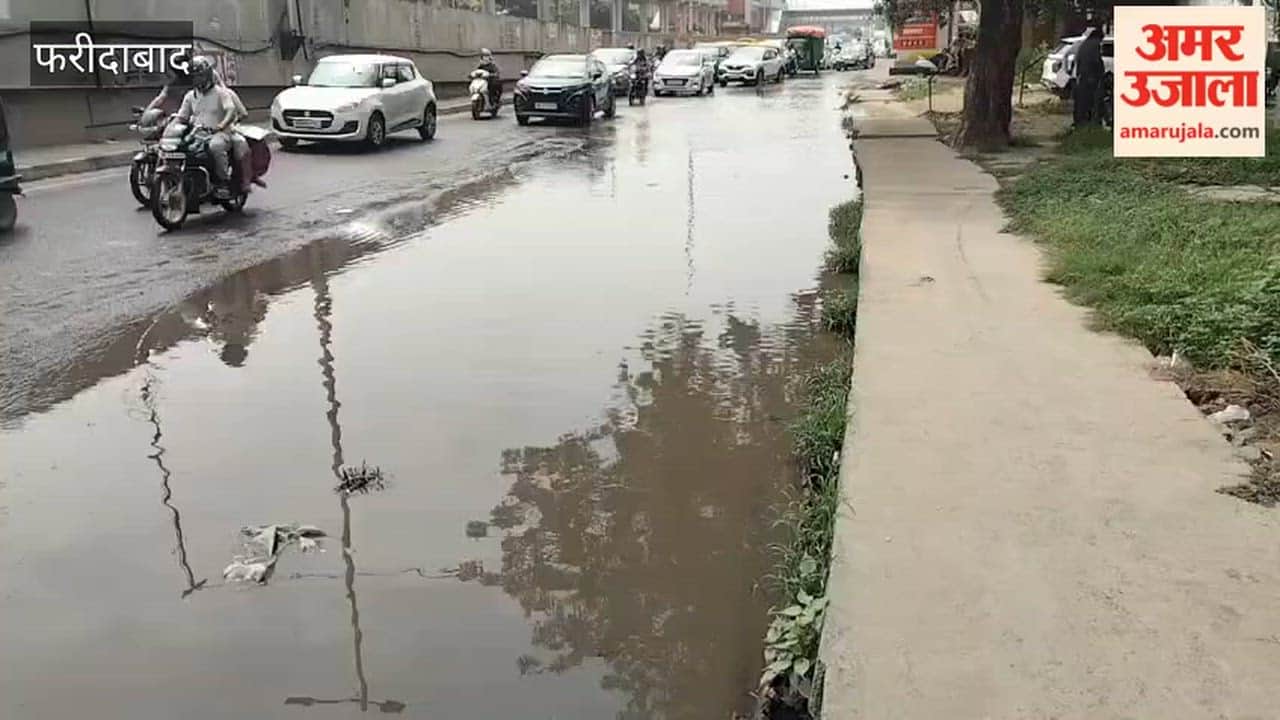 Faridabad Rainwater causes traffic jam on service road and motorists inconvenienced
