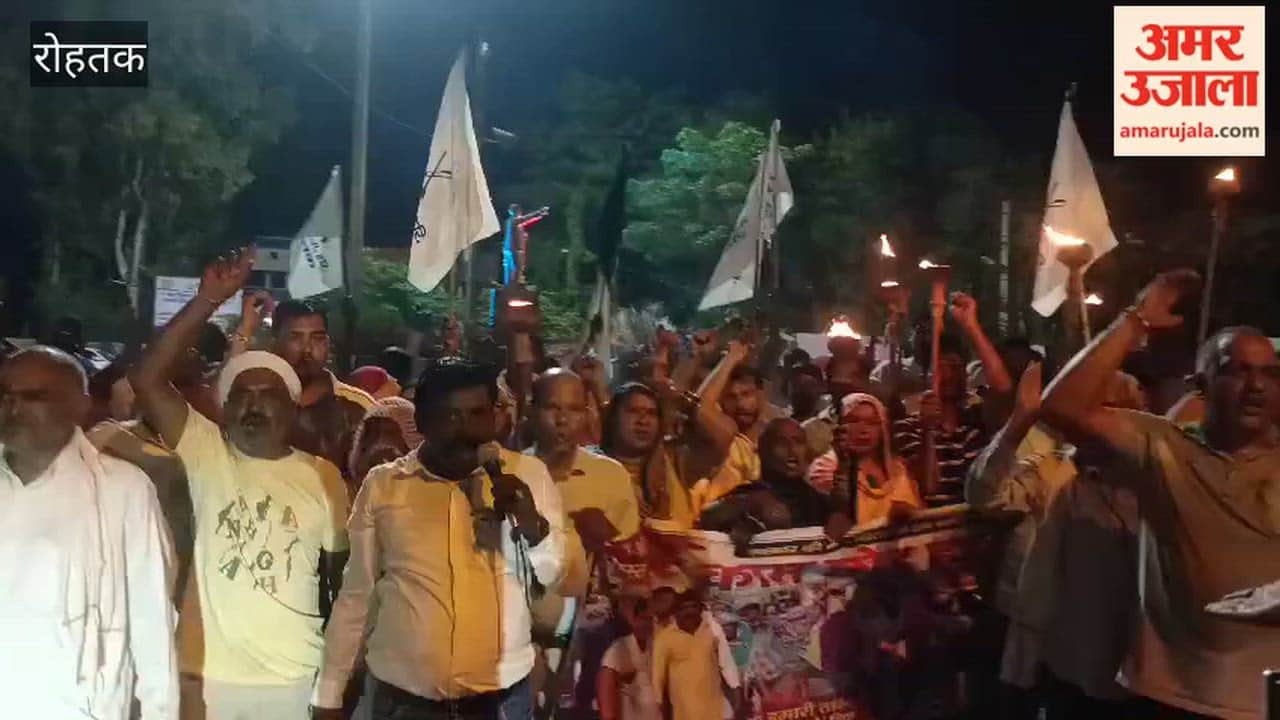 Striking sanitation workers took out a torchlight procession in Rohtak.