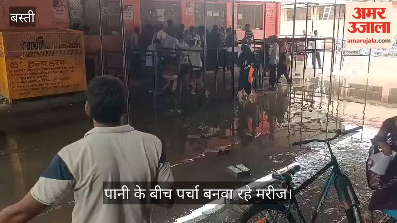 Patients getting registration slips made amidst mud and water at the district hospital.