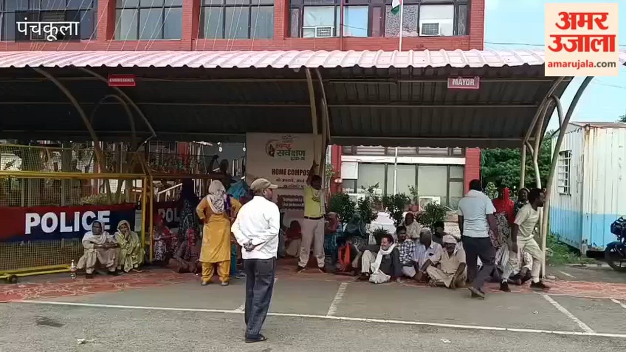 Sanitation workers stage a protest at the municipal corporation office gate in Panchkula.
