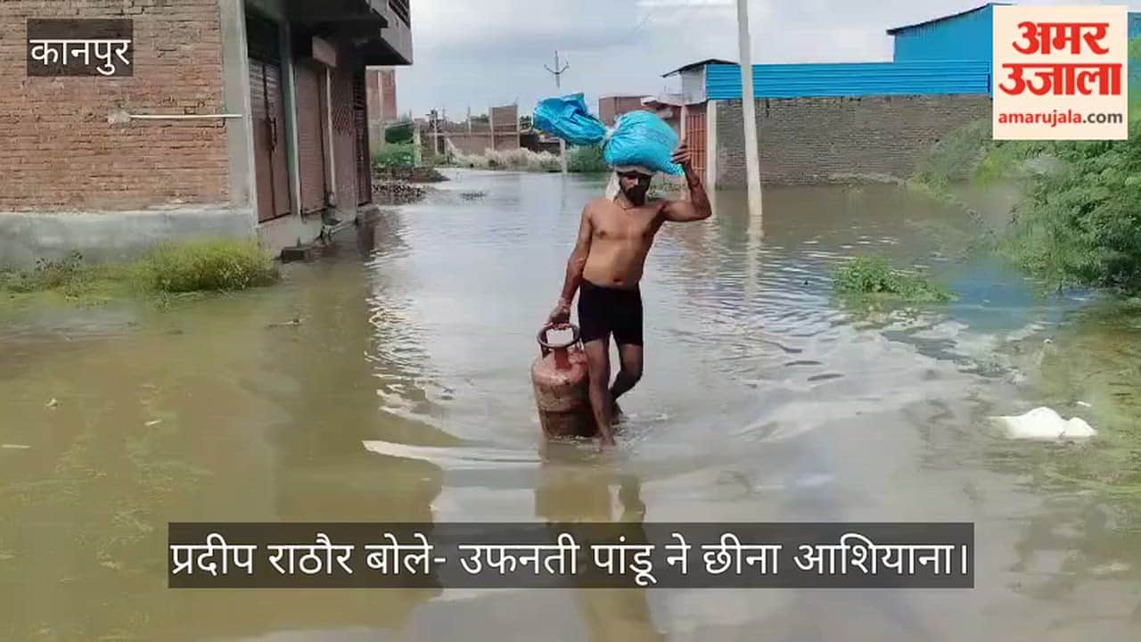 Kanpur Pandu Rivers surge causes hardship residents flee with household belongings on their heads