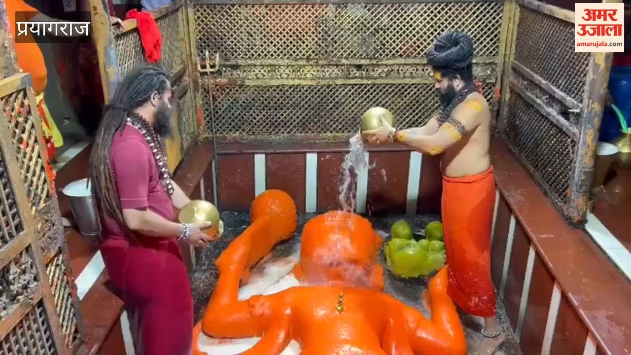 Shri Bade Hanumanji awakens after the retreat of Mother Ganga; temple doors open.