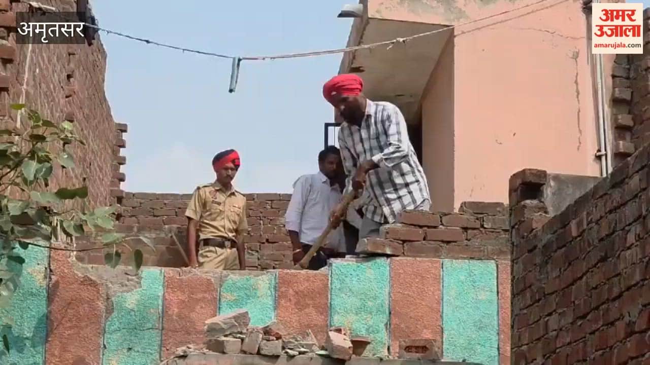 Municipal corporation's bulldozer razes illegal property of accused drug trafficker.