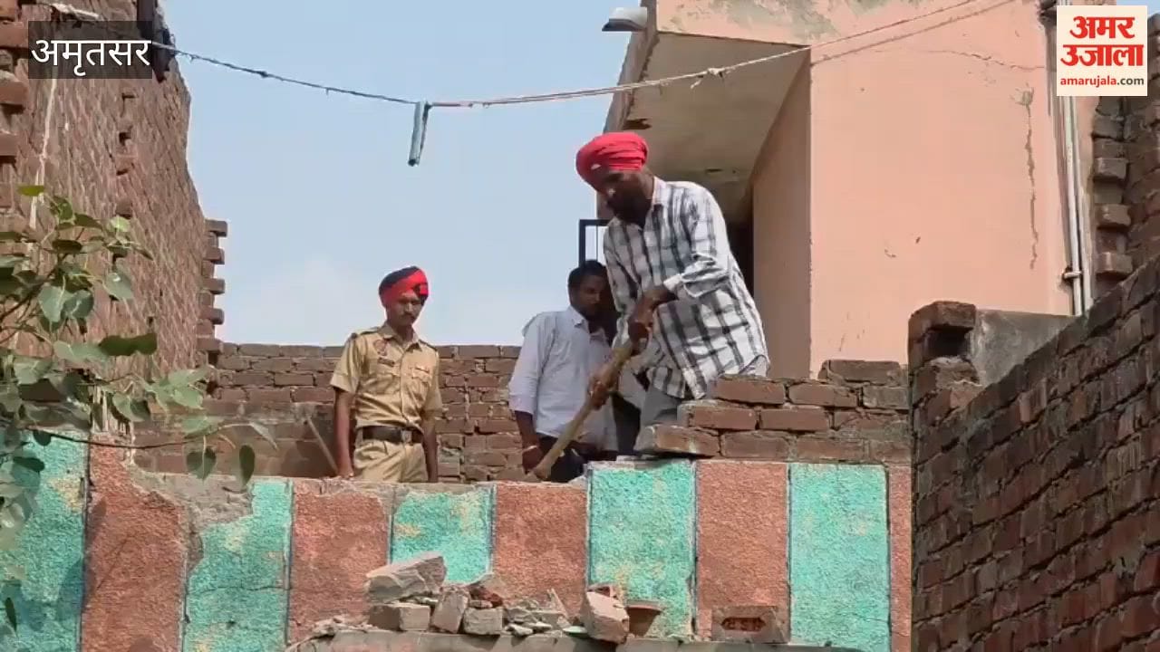 Municipal corporation's bulldozer razes illegal property of accused drug trafficker.