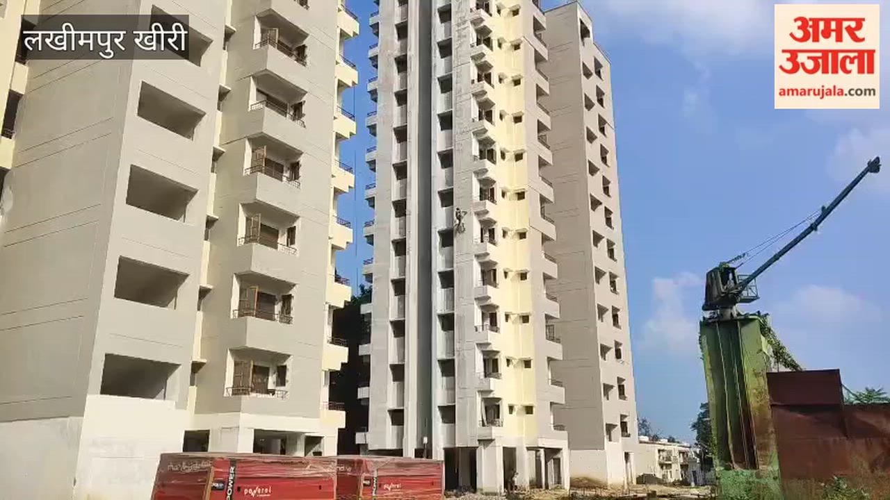 Painting work being done on the eighth floor in Lakhimpur Kheri using a rope