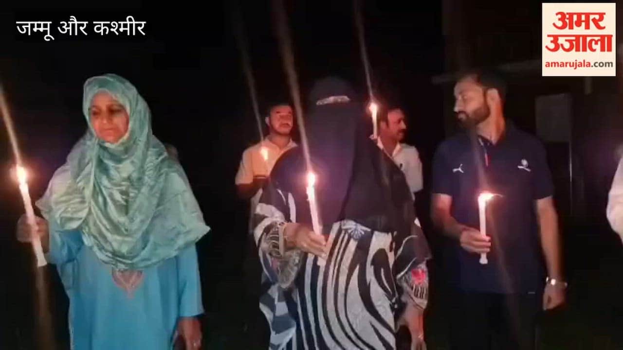 NHM employees held a candle march in Ganderbal, intensifying their ongoing protest over their long-pending demands.