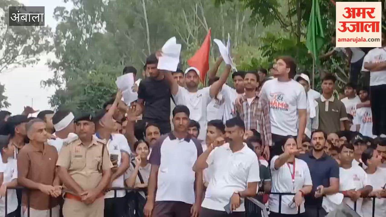 Youths waved placards highlighting poor condition of roads in front of CM during a marathon event in Ambala