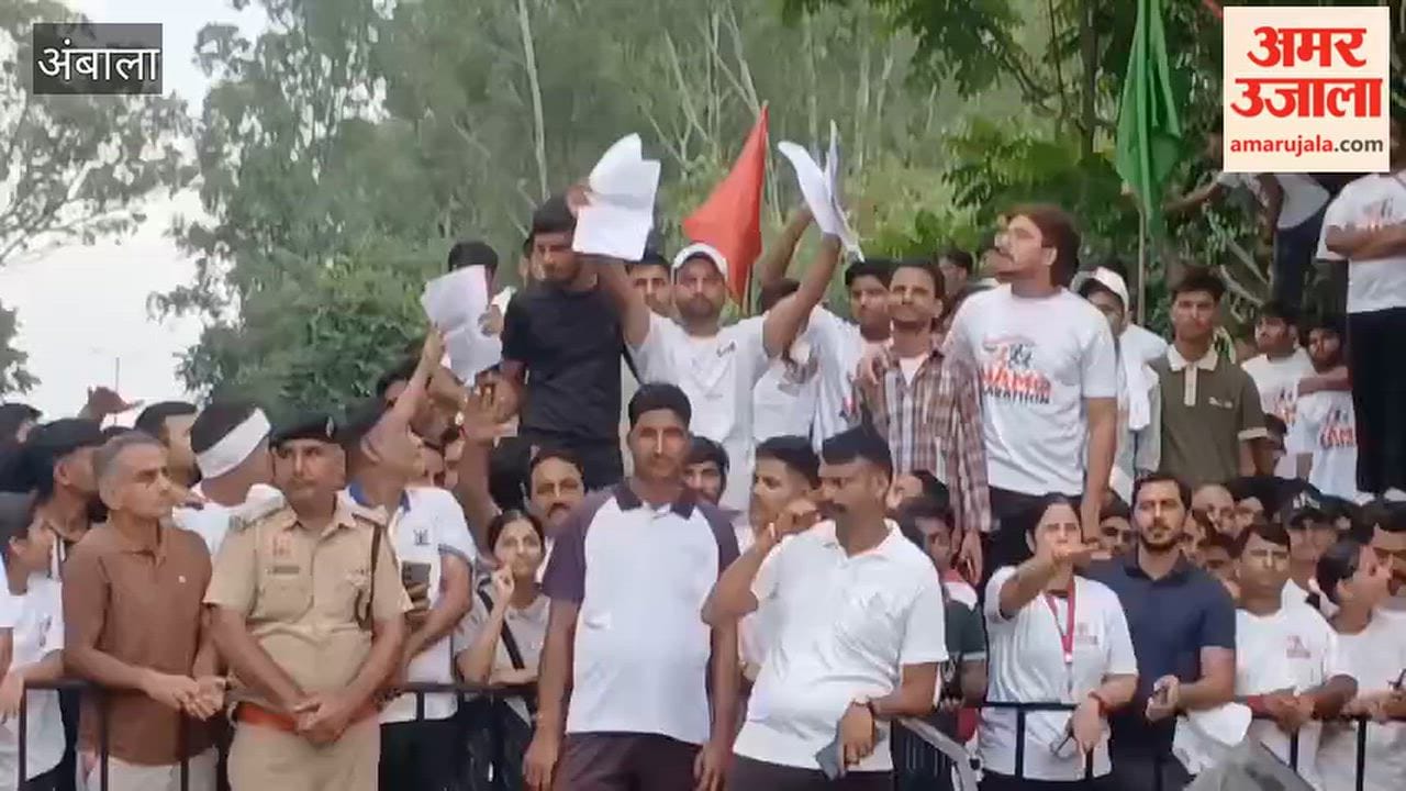 Youths waved placards highlighting poor condition of roads in front of CM during a marathon event in Ambala