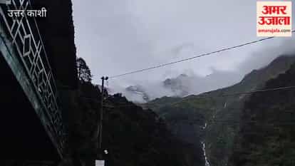 Rain at Yamunotri Dham and the season's first snowfall on high-altitude peaks