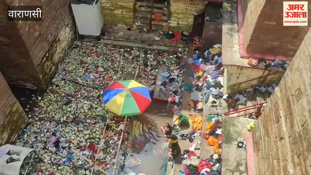 Heaps of discarded clothes lying around after bath at Lolark Kund
