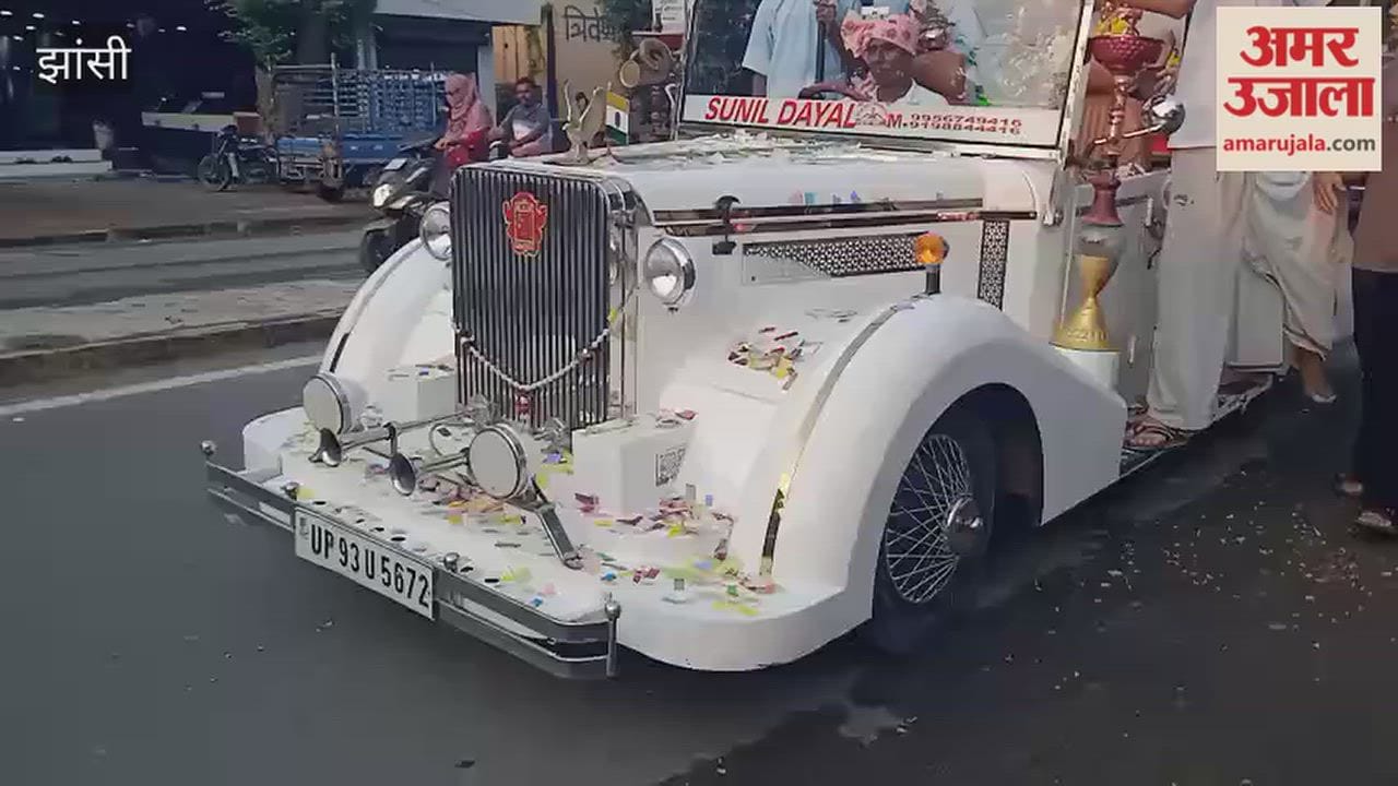 Lord Ganesha's immersion procession taken out in a vintage car.
